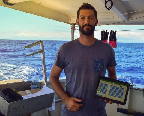 An observer coordinator using the app on a boat at sea. 